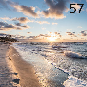 Motiv: Sandstrand mit Abendsonne